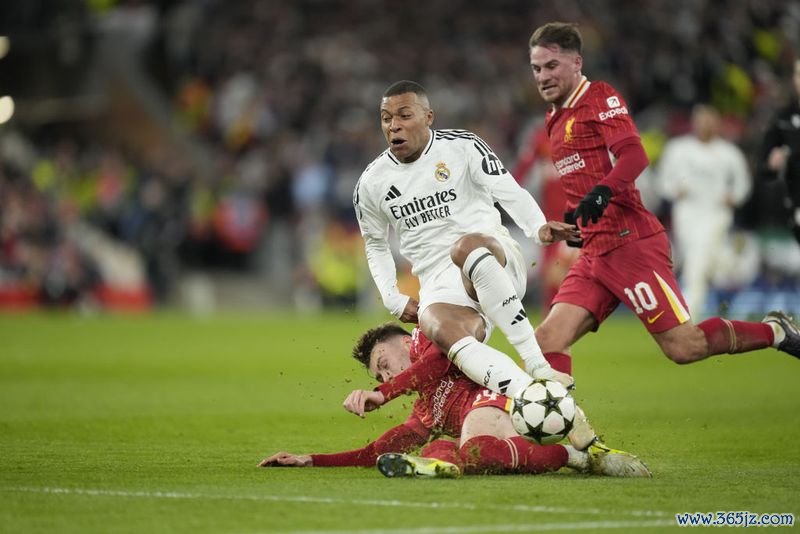 LIVERPOOL, ENGLAND - NOVEMBER 27: Kylian Mbappe centre-forward of Real Madrid and France and Conor Bradley right-back of Liverpool and Northern Ireland compete for the ball during the UEFA Champions League 2024/25 League Phase MD5 match between Liverpool FC and Real Madrid C.F. at Anfield on November 27, 2024 in Liverpool, England. (Photo by Jose Hernandez/Anadolu via Getty Images)