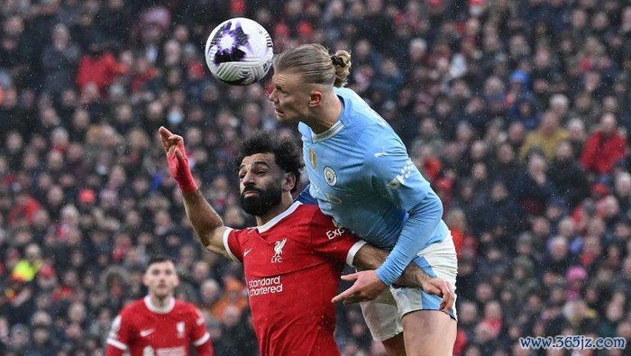 LIVERPOOL, ENGLAND - MARCH 10: (THE SUN OUT. THE SUN ON SUNDAY OUT) Manchester Citys Erling Haaland with Mohamed Salah of Liverpool during the Premier League match between Liverpool FC and Manchester City at Anfield on March 10, 2024 in Liverpool, England. (Photo by John Powell/Liverpool FC via Getty Images)